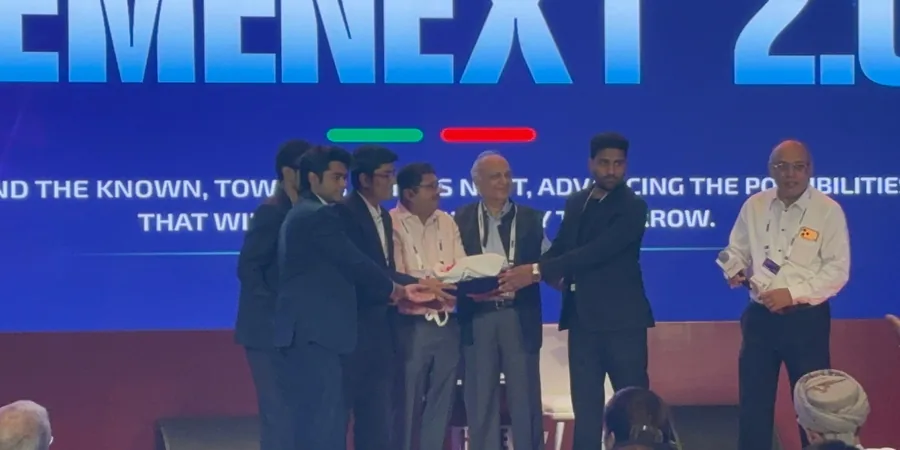The AURVIZ team being presented with the Best Startup Pitch award on stage at HemeNext 2026