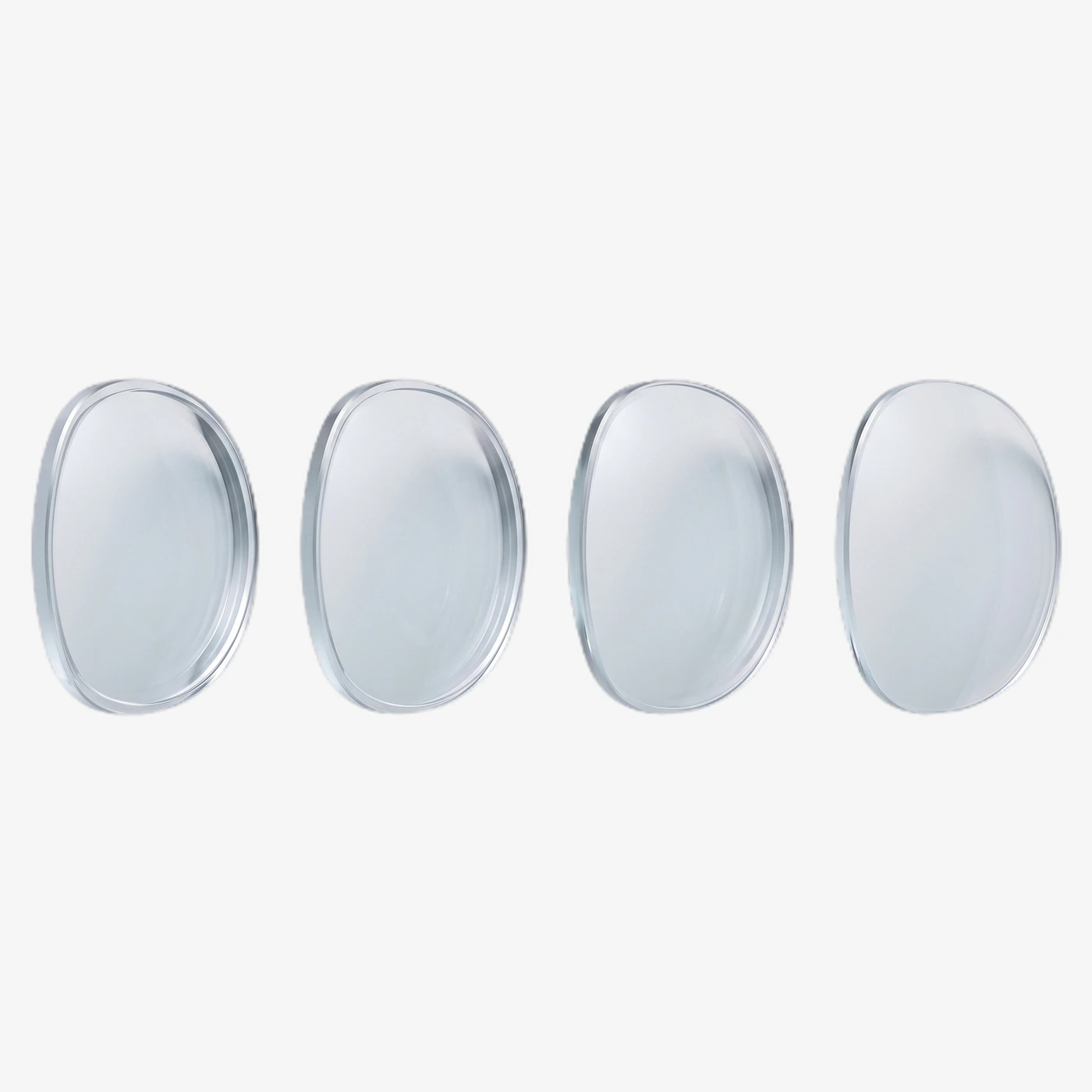Four clear lens blanks in a row, each ground to a different
                                prescription, the edge thickness changing from one to the next