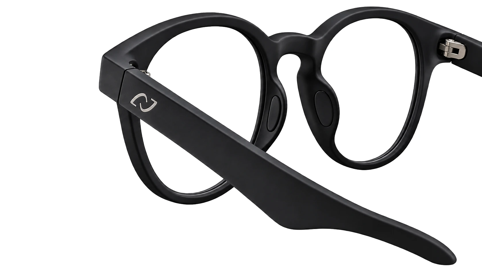 The AURVIZ o1 frame from three quarters, the nose pad between the rims where the bone conduction microphone sits