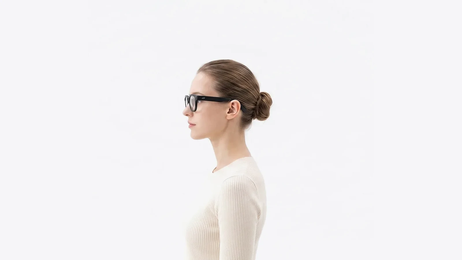 A woman in profile wearing AURVIZ o1